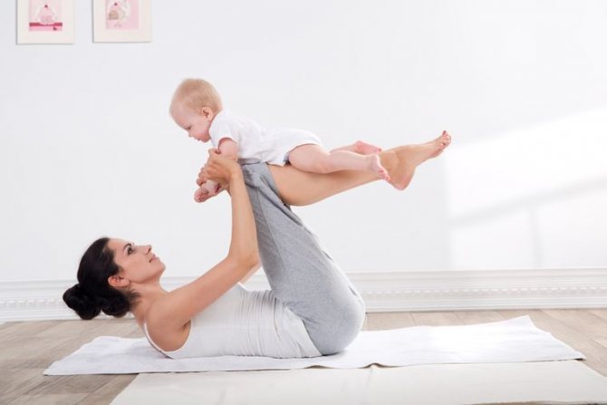 mother and baby doing fitness